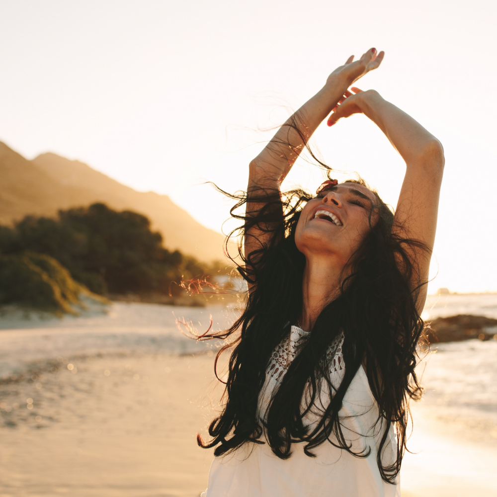 women looking up at sky happy